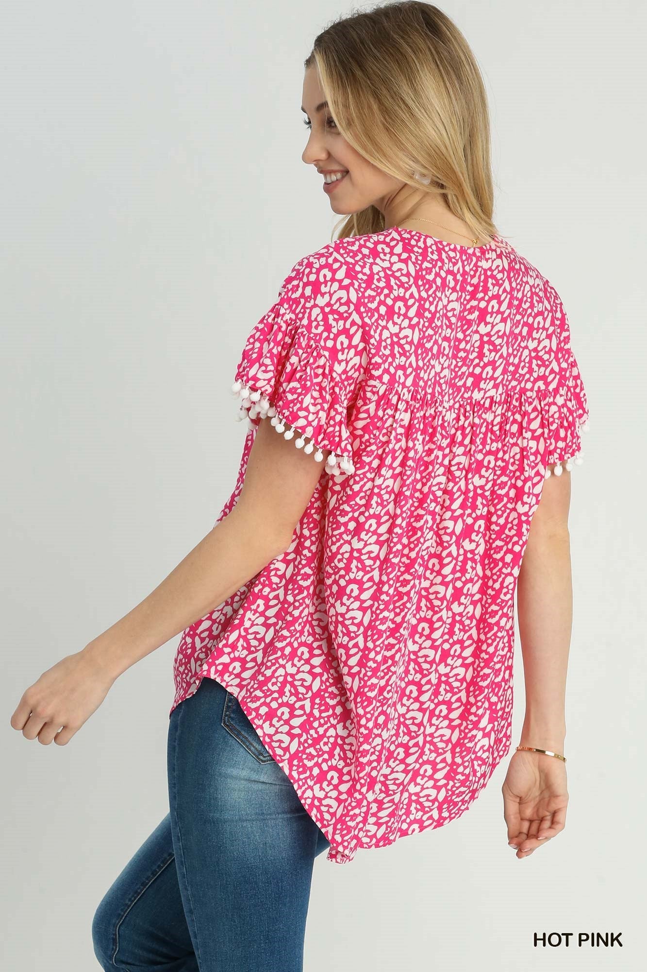 Animal Print Split Neck Ruffle Sleeve Top With Pom Pom Fringe Detail & Flower Embroidery - Mainstream Boutique