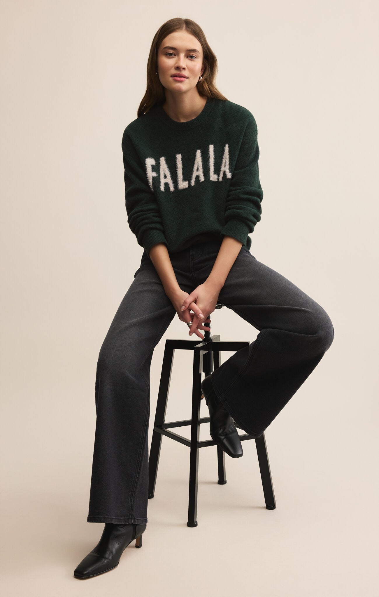 Dark Green holiday sweater with white lettering