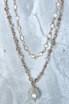 Pearl, crystals layered on two separate gold chains.  