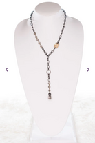 gunmetal lariat necklace adorned with crystals, beads and a crystal pendant.