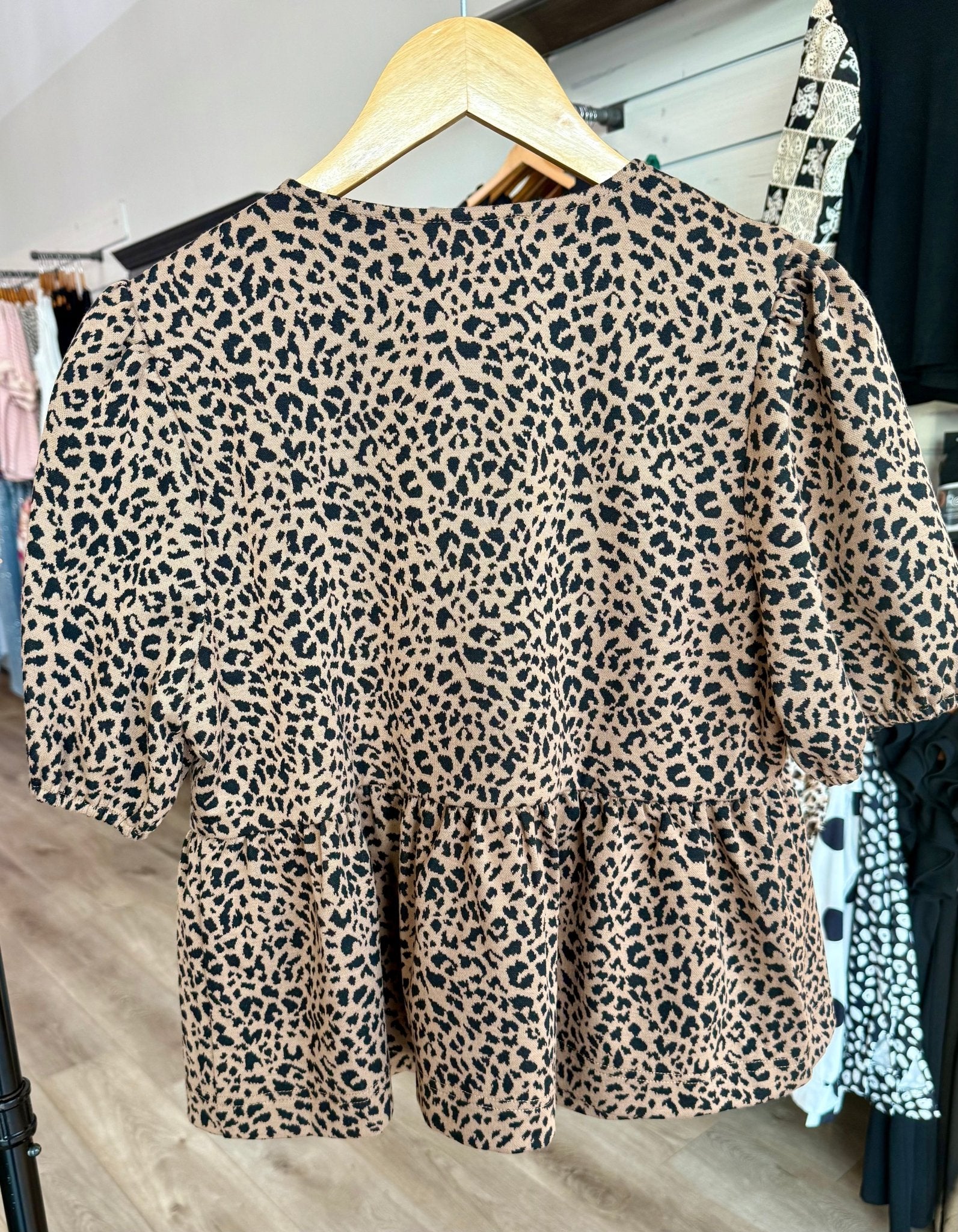 COTTON ANIMAL PRINT PUFF SHORT SLEEVE BOW TIE FRONT PEPLUM - Mainstream Boutique