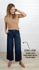 A woman wearing the Mac and Me Wide Leg Trouser with Tulip Hem with a the camel colored Funnel Neck Mac and Me in the color, Carmel.  She is also wearing camel colored slingback shoes.  This outfit styled together creates a stylish fall staple