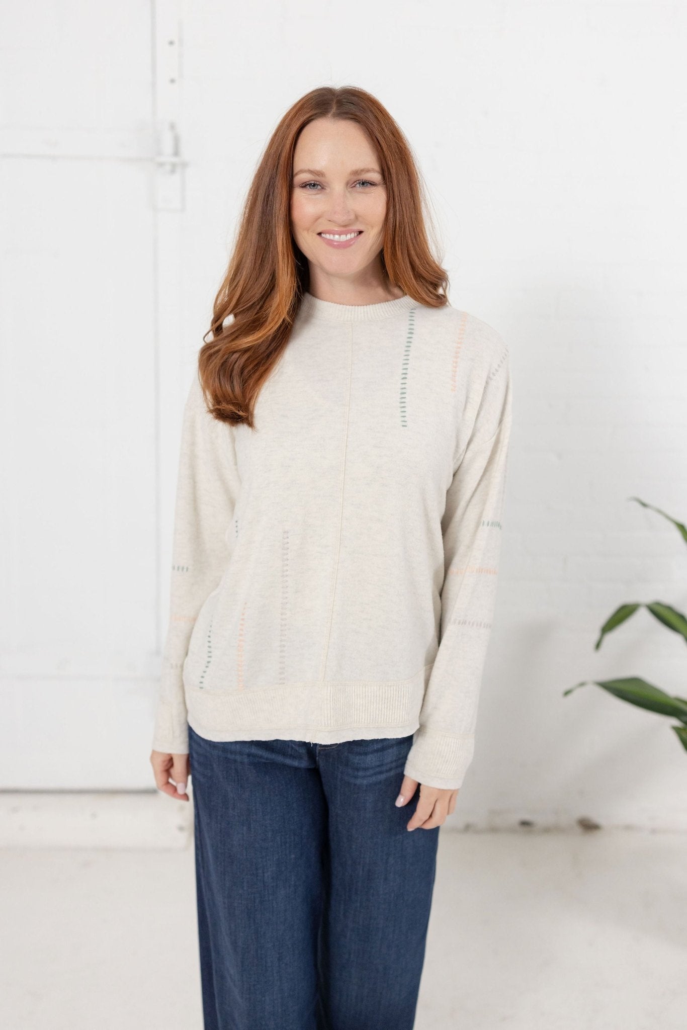 Long Sleeve Top With Embroidery Detail And Asymmetrical Hem - Mainstream Boutique