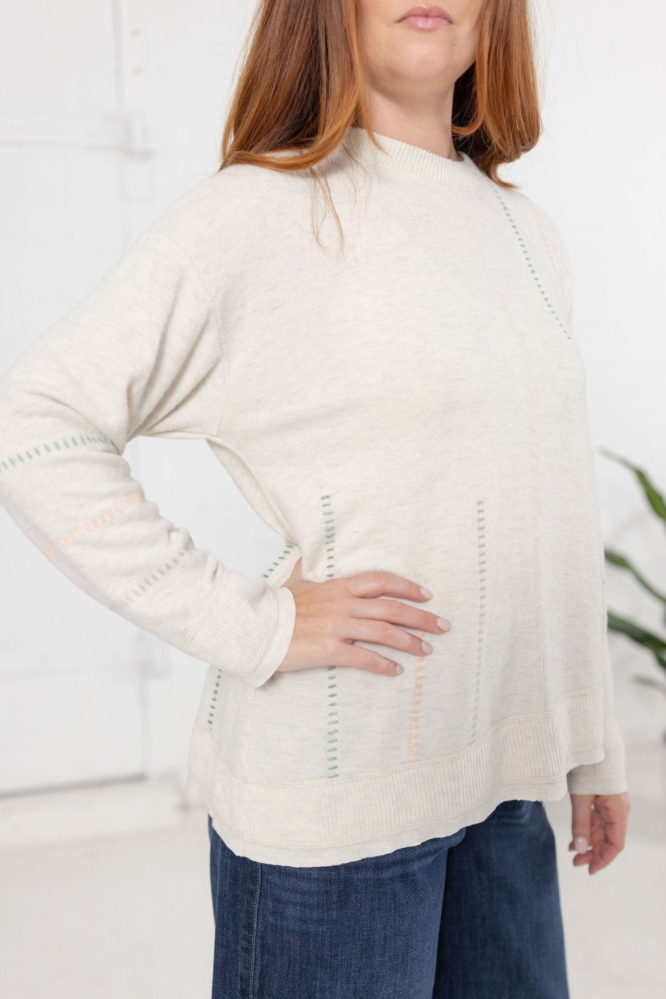 Long Sleeve Top With Embroidery Detail And Asymmetrical Hem - Mainstream Boutique