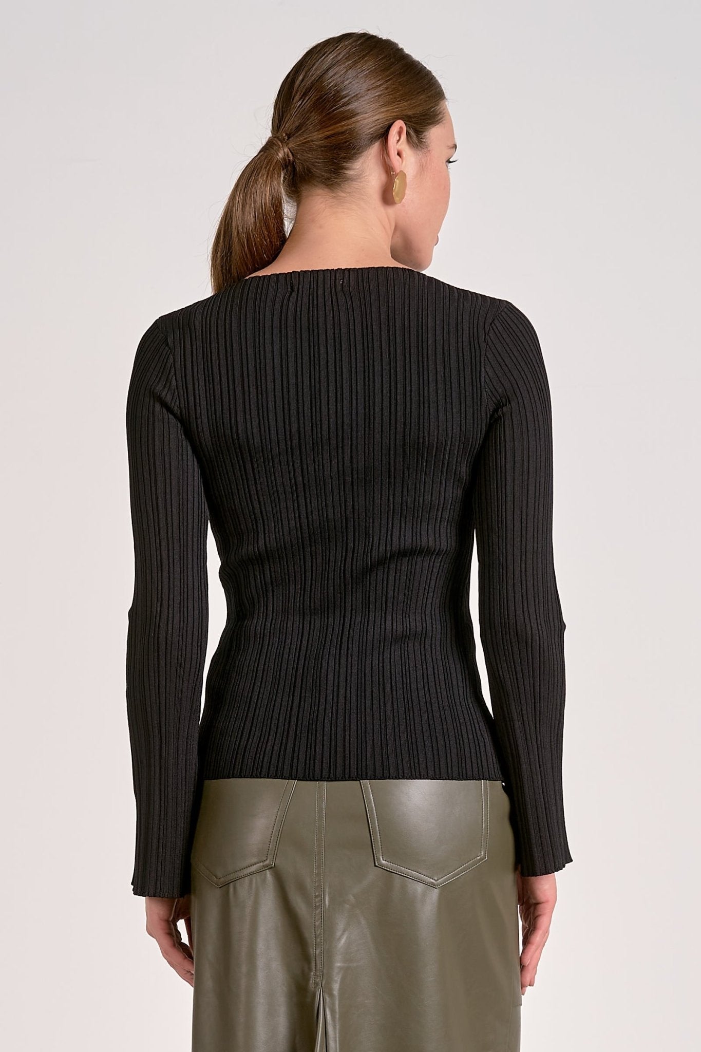 Back side of black ribbed bell sleeve long sleeve top for women
