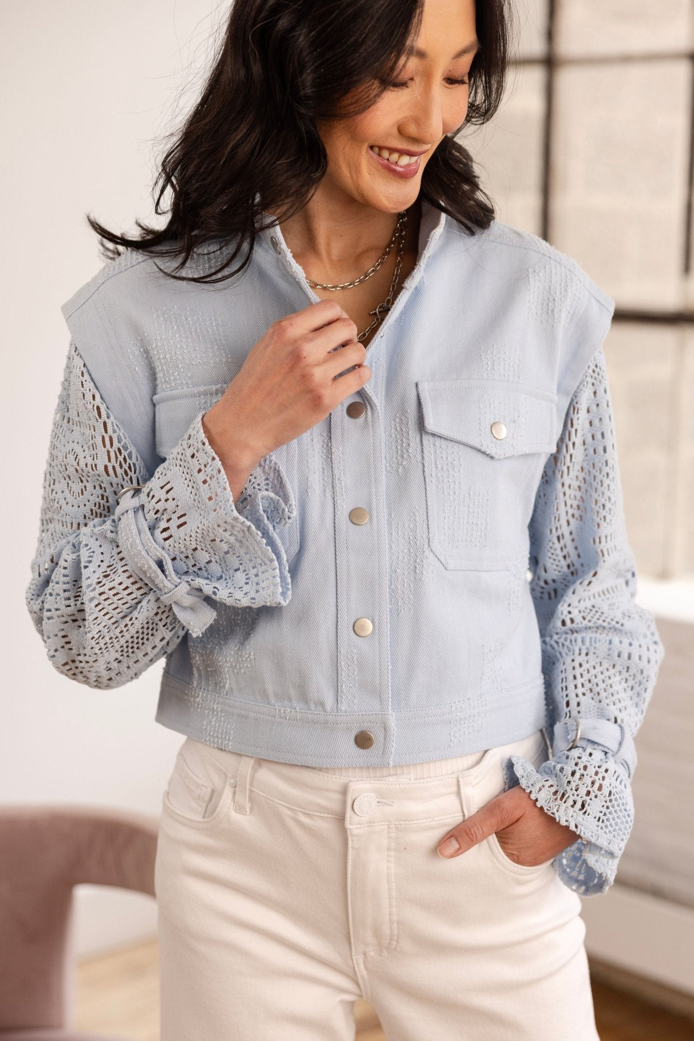 blue breeze denim jacket with crochet sleeves and belted cuffs