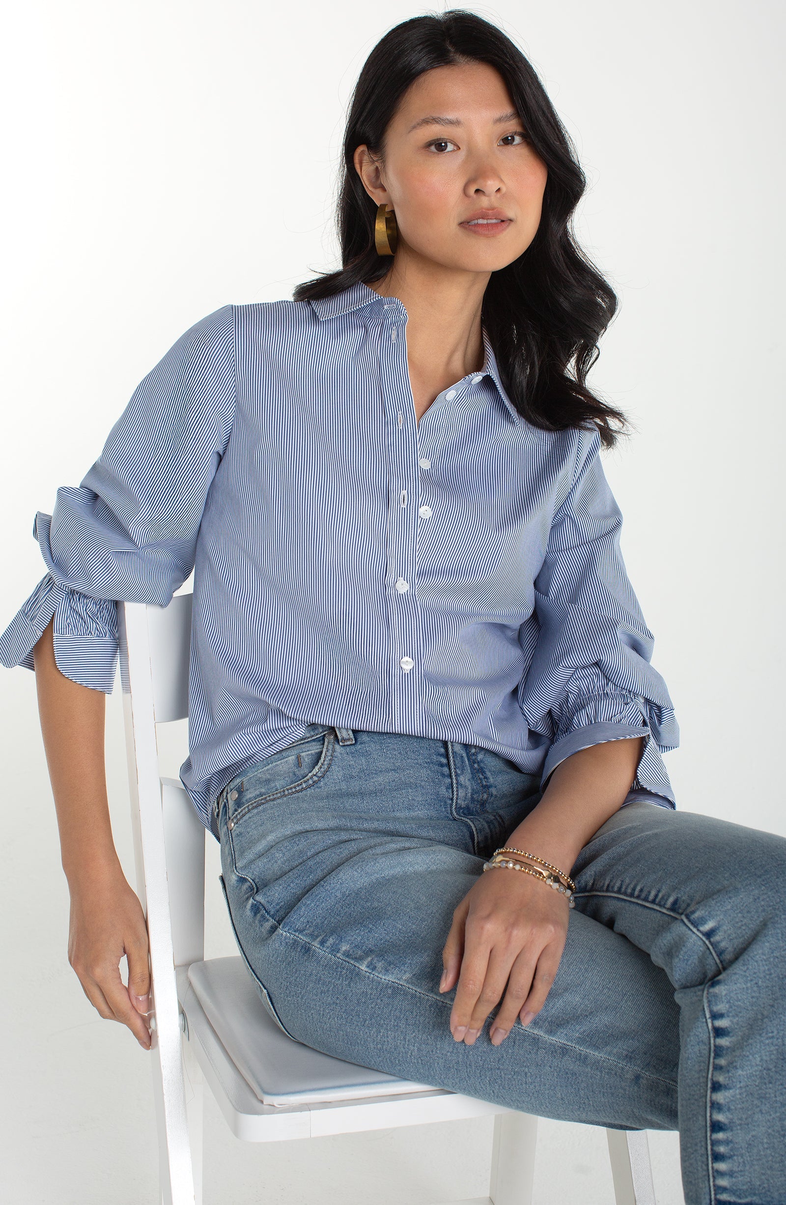Light blue striped button up shirt, with adjustable sleeve detail