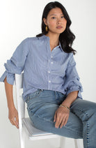 Light blue striped button up shirt, with adjustable sleeve detail